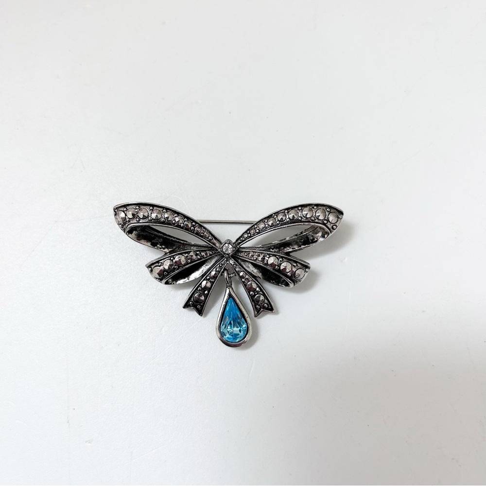 Vintage Avon Silver-Tone Bow Brooch with Blue Teardrop Accent